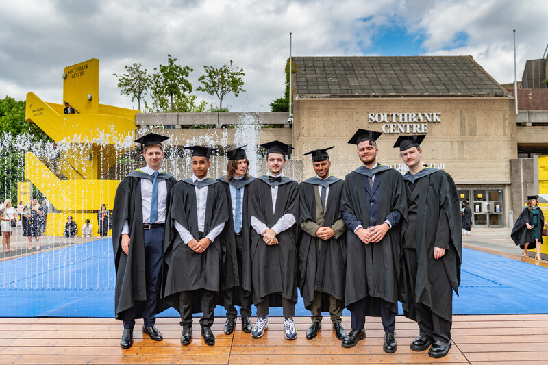 A group of students pose in their gowns