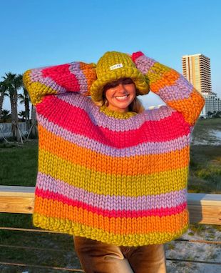 Image shows a model wearing colourful knitwear designed by Hope Macaulay