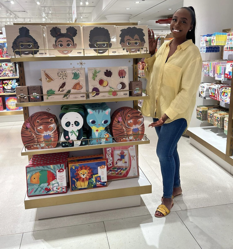 Little Omo founder Desriee Asomuyide stands with her products in Selfridges