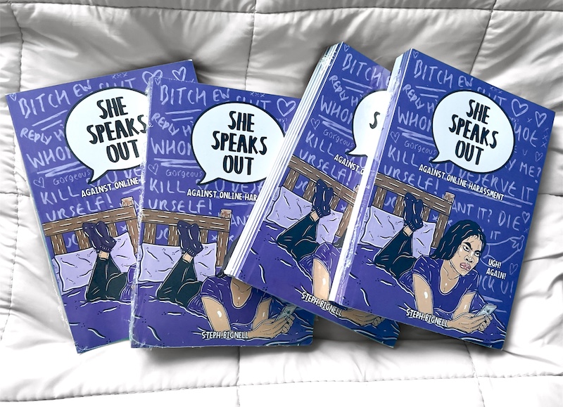 Image shows copies of the She Speaks Out zine by Stephanie Bignell