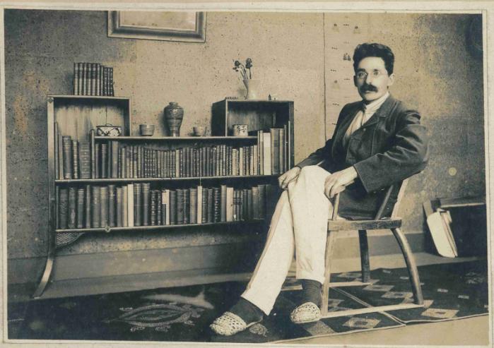 Bernard Leach sitting in a chair in his Tokyo home