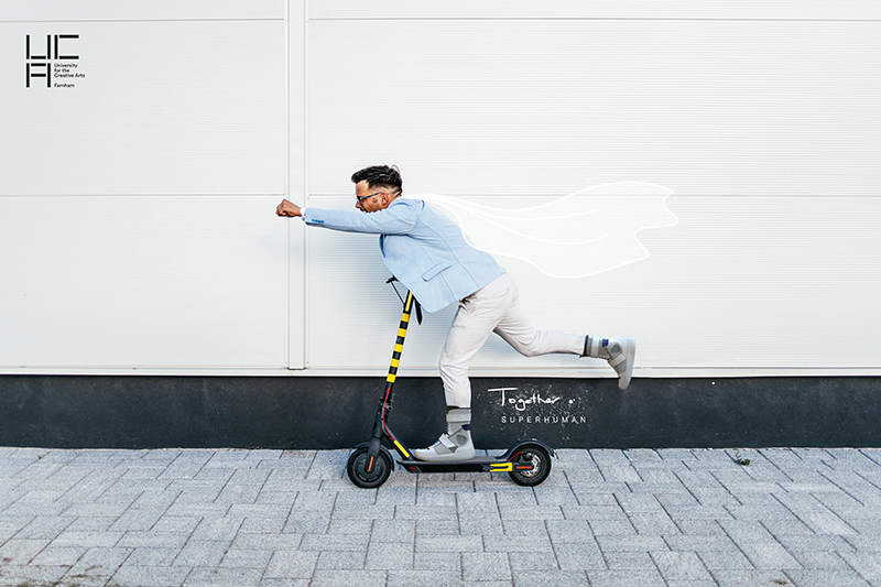 The Superhuman Shoe in action, modelled by a man riding a scooter