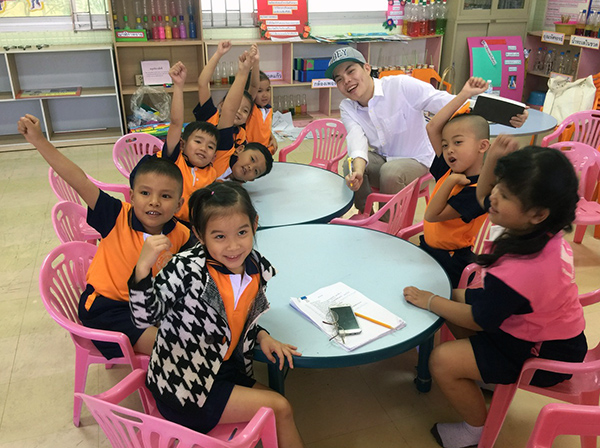 Veerapong with a group of Thai school children